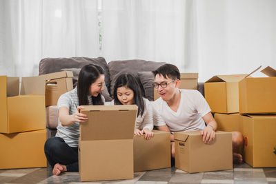 Young couple sitting in box