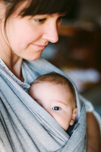 Close-up of cute baby with mother