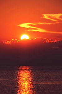 Scenic view of sea against romantic sky at sunset