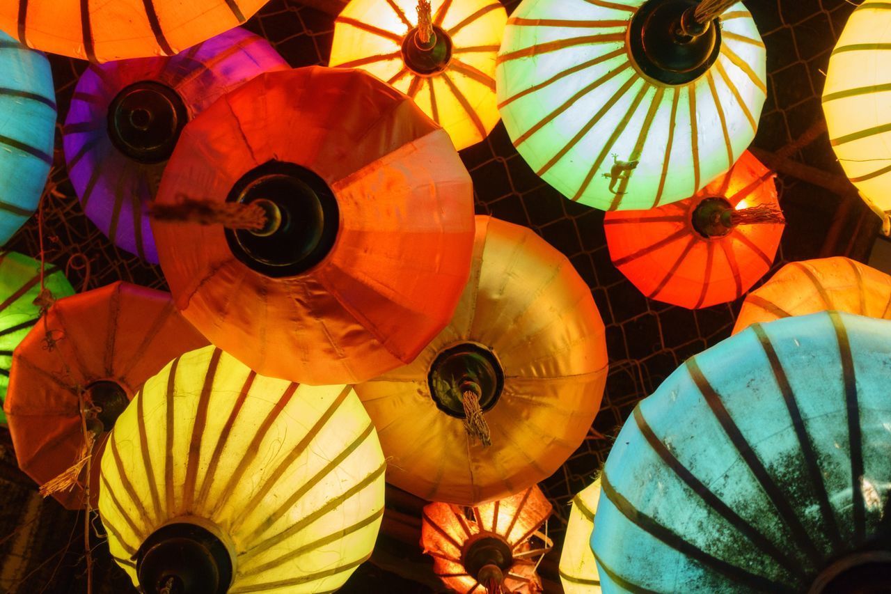 DIRECTLY BELOW SHOT OF MULTI COLORED UMBRELLAS IN METAL