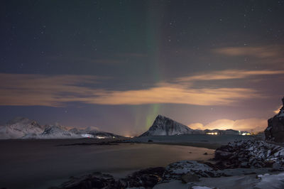 Scenic view of mountains against sky at night