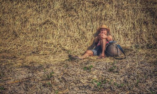 Woman sitting on field