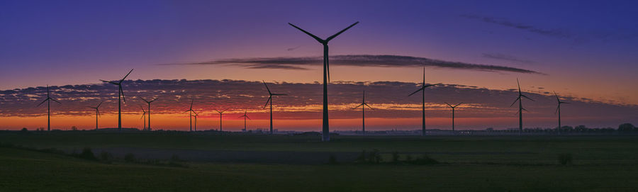 Scenic view of field against sky during sunset