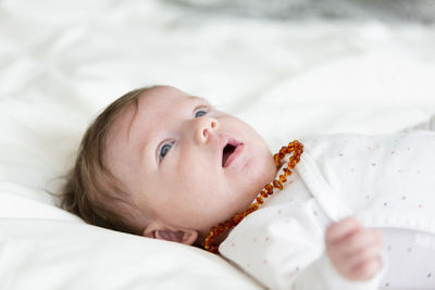 Cute baby lying on bed