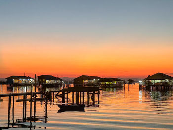 Scenic view of buildings against sky during sunset