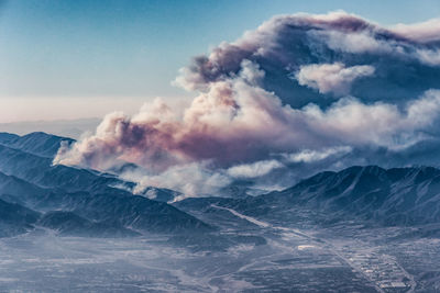 Scenic view of mountains against cloudy sky