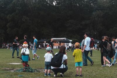 Group of people standing in the dark
