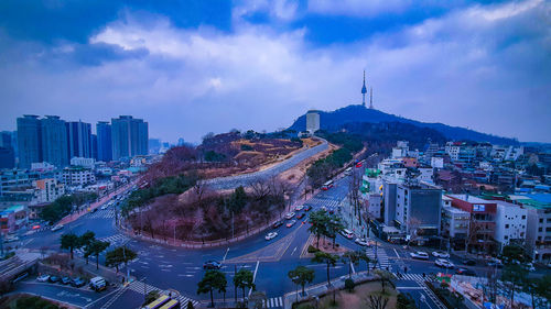 High angle view of buildings in city against sky