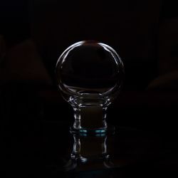 Close-up of wineglass against black background