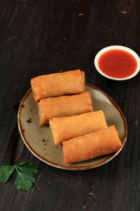 Crispy chinese spring roll with sweet and spicy chilli sauce