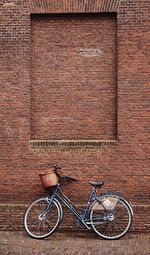 Bicycle against brick wall