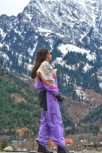 Rear view of man looking at mountains