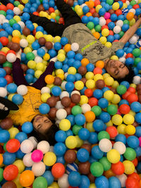 High angle view of people in multi colored balloons