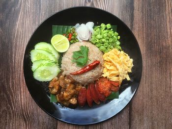 High angle view of fruits in plate on table
