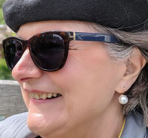 Close-up of smiling woman wearing sunglasses