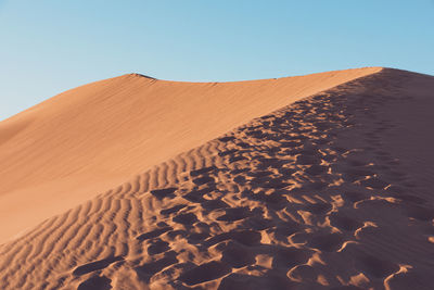 Scenic view of desert against clear sky