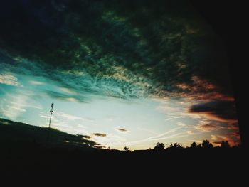 Silhouette of trees against sky at sunset