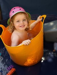 Portrait of cute baby boy in water