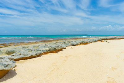 Scenic view of beach against sky