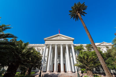 Low angle view of former national congress building against clear blue sky