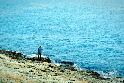 Scenic view of sea against blue sky
