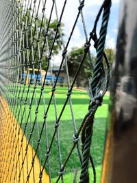 Close-up of ropes on fence