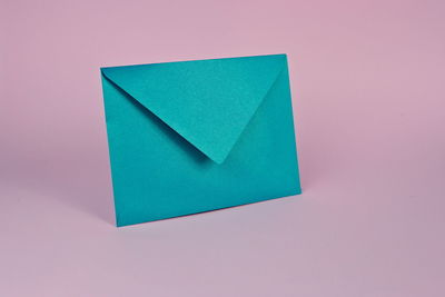 High angle view of paper against colored background