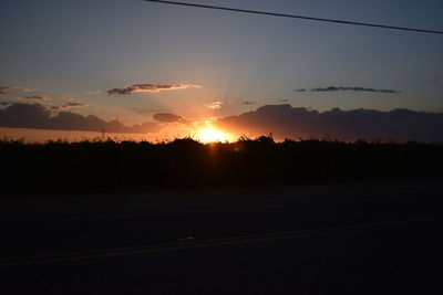 Scenic view of silhouette landscape against sky during sunset