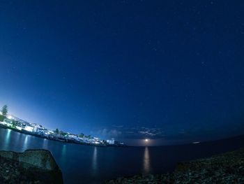 Scenic view of sea against sky at night