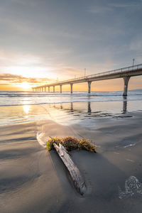 Beautiful sunrise over the new brighton pier at christchurch, new zealand.