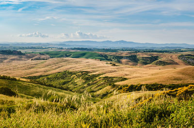 Scenic view of agricultural field against sky in tuscany, italy