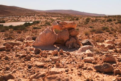 Rock formations on landscape against sky