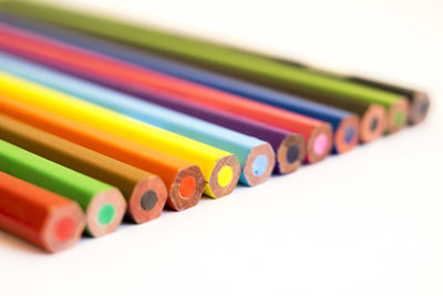 High angle view of colorful pencils on white background