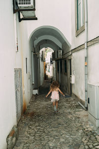 Rear view of woman walking on street