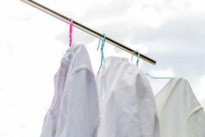 Low angle view of clothes drying on white background