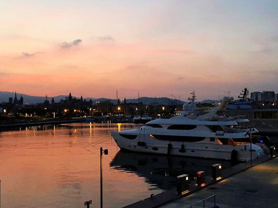 nautical vessel, transportation, sunset, mode of transport, boat, moored, water, sky, harbor, waterfront, river, illuminated, orange color, sea, dusk, reflection, cloud - sky, building exterior, built structure, architecture