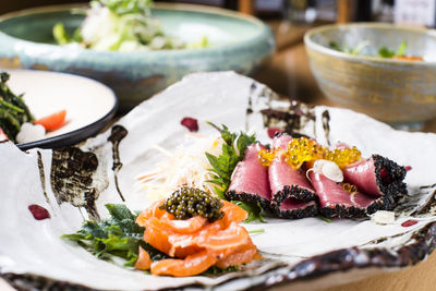 Close-up of sushi served on table