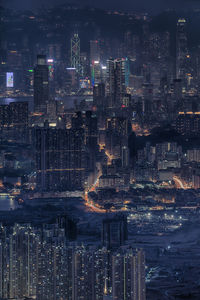 High angle view of illuminated buildings in city at night