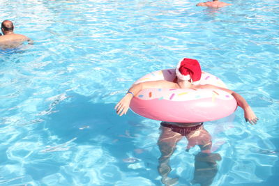 High angle view of woman swimming in pool