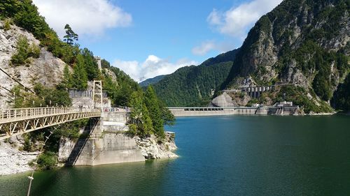 Kurobe dam against sky on sunny day