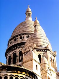 Low angle view of basilique du sacre coeur against clear blue sky