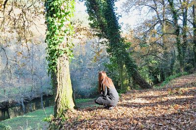 Woman sitting in a forest