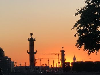 Silhouette of city during sunset