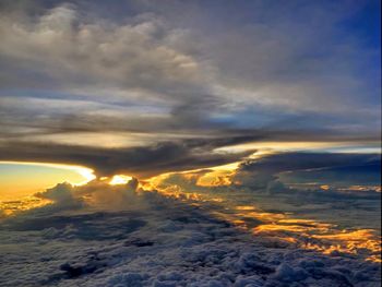 Aerial view of dramatic sky over sea during sunset