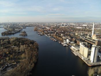 High angle view of river amidst buildings in city