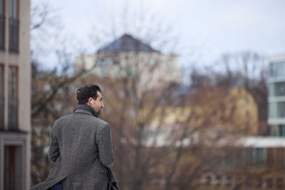 Elegant man walking on street