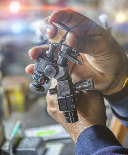 Midsection of man holding mobile phone