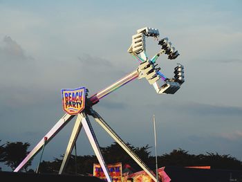 Low angle view of ferris wheel against sky