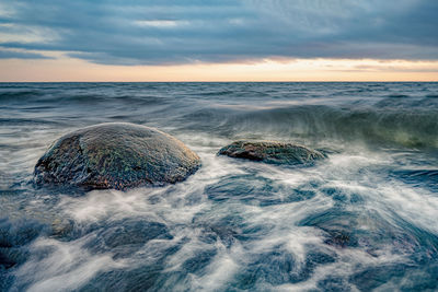 Scenic view of sea against sky during sunset