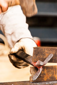 Close-up of man working on wood